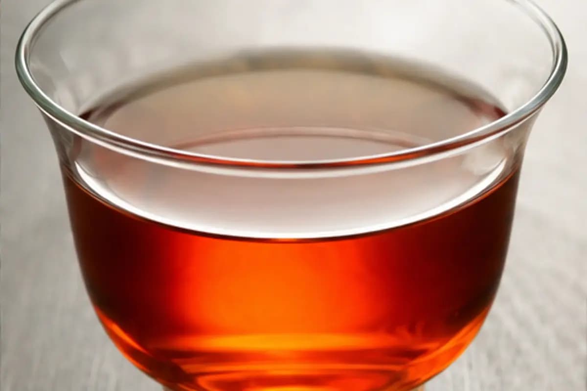 Bright amber-red liquor of imperial grade black tea